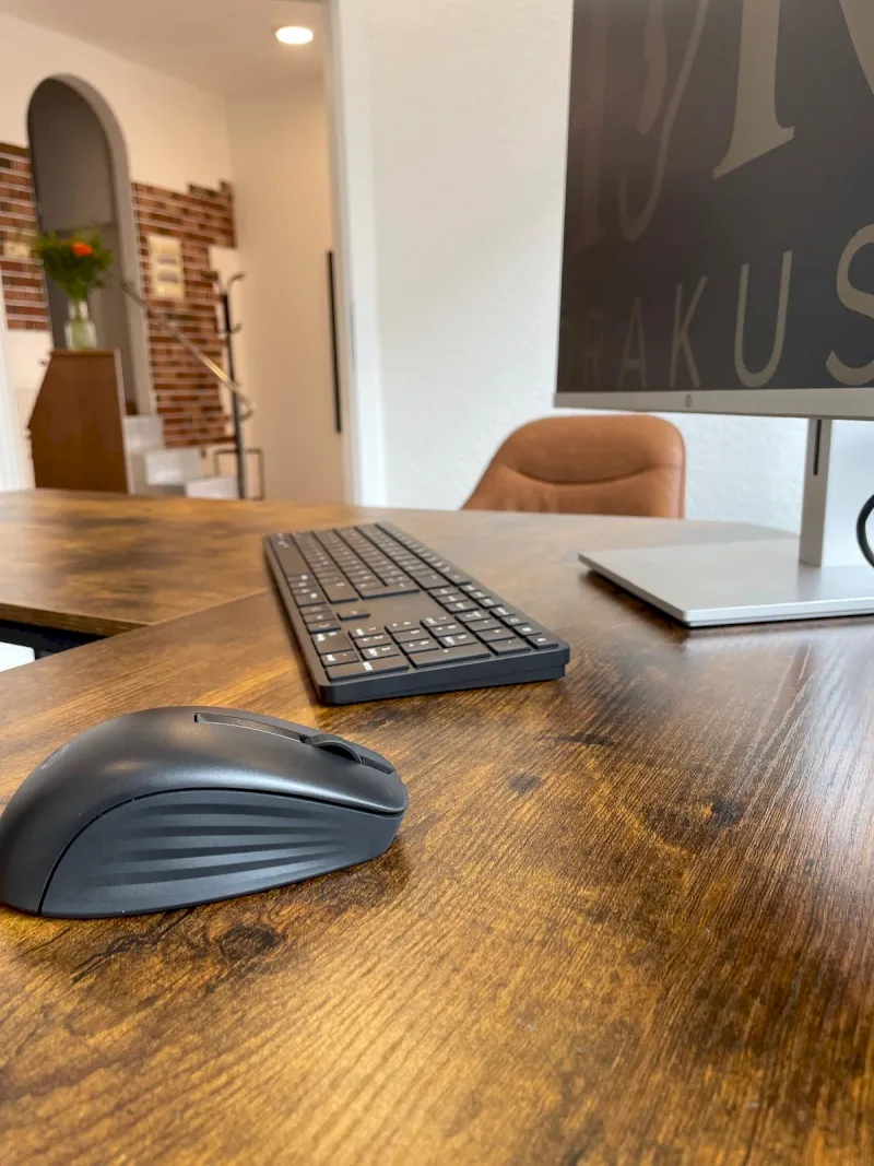 black flat screen tv on brown wooden table