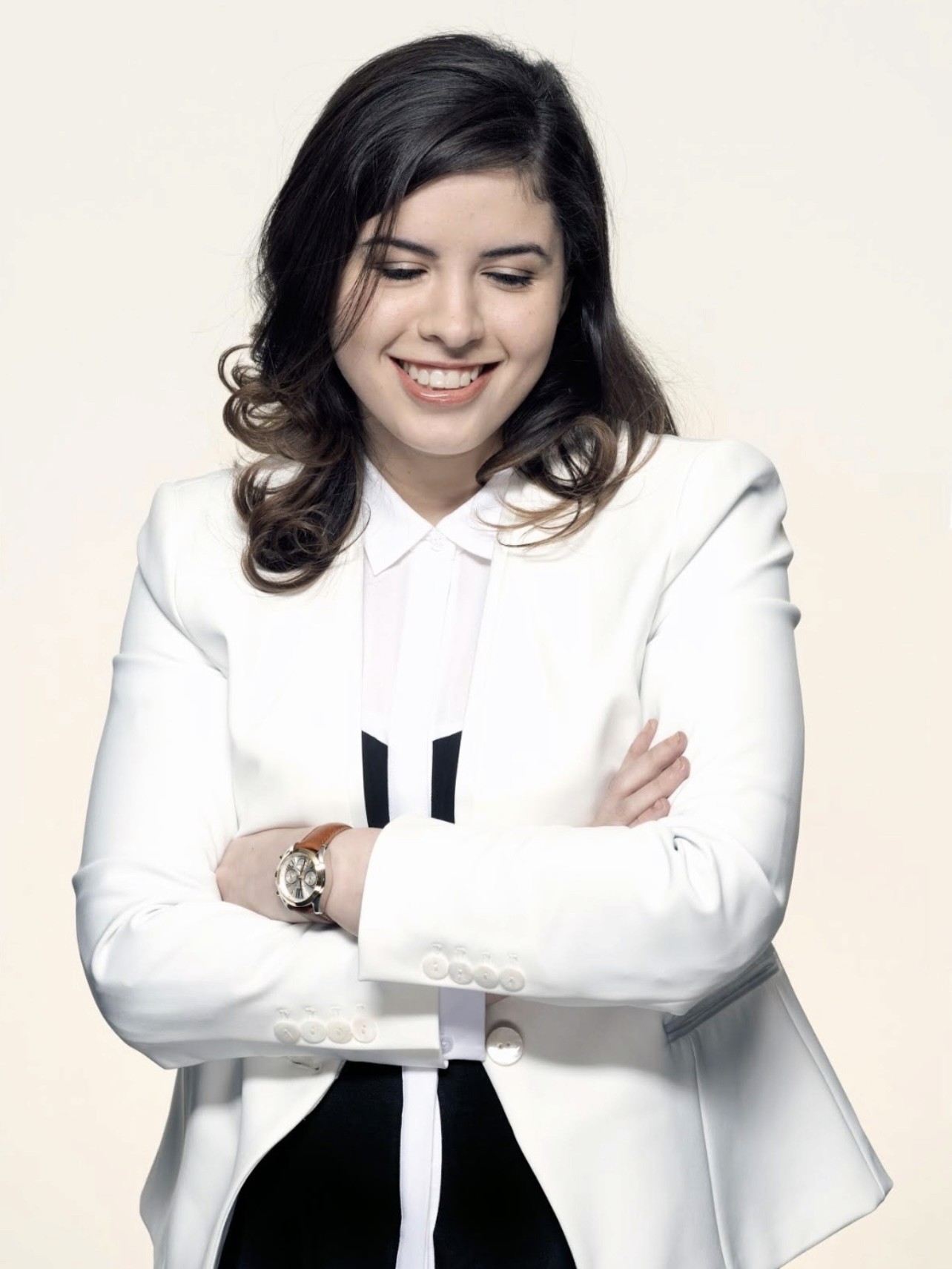 Visual designer in a minimalist studio with an iPad