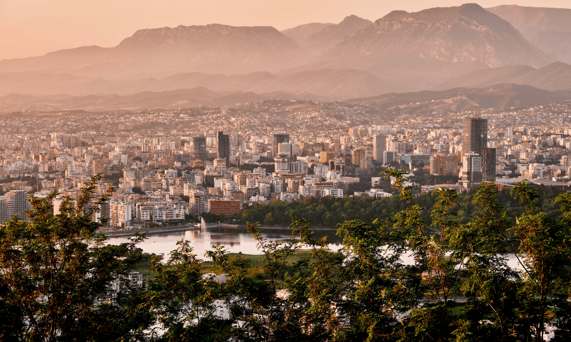 Spectacular sunset over Tirana, inviting investors to discover how to open a business in Albania.