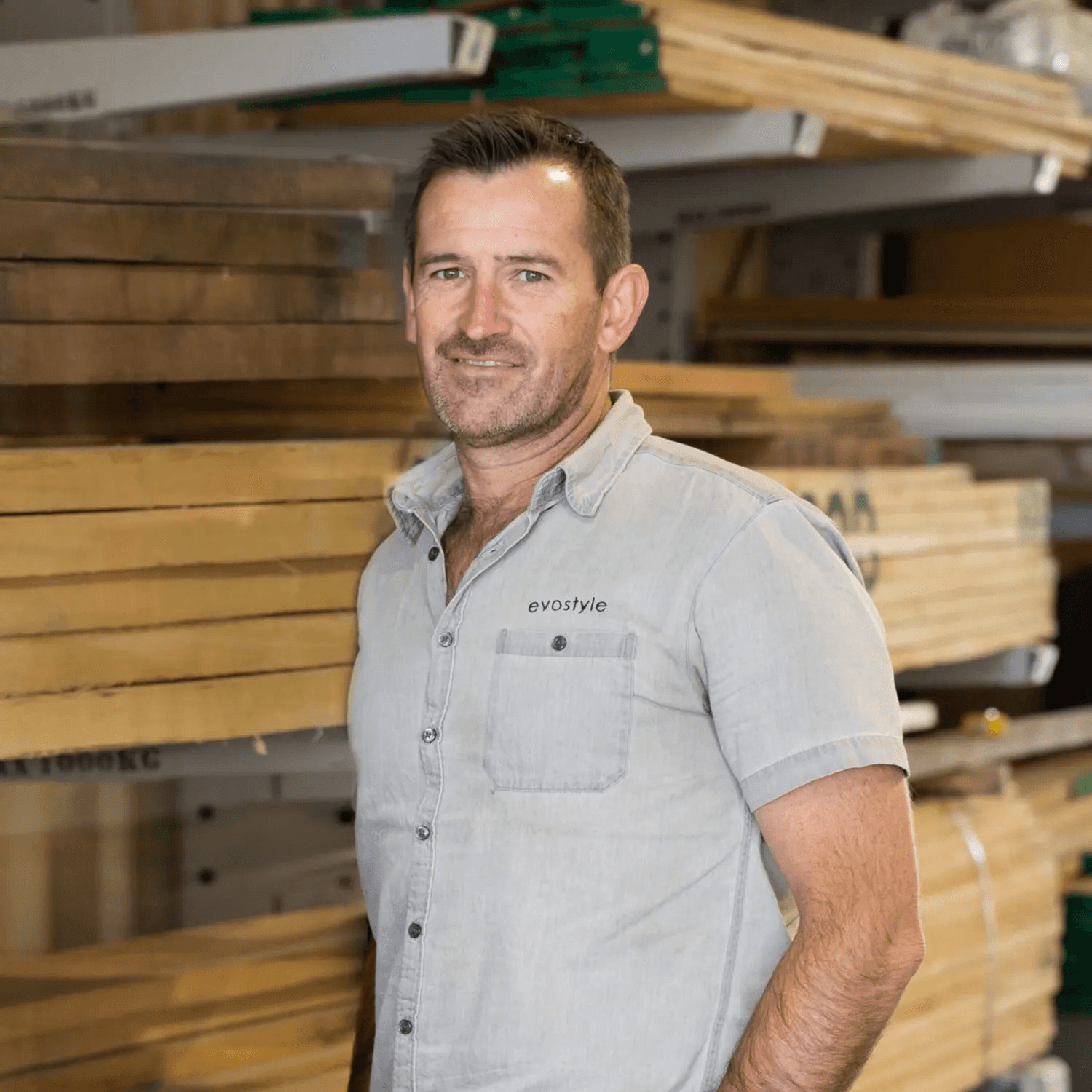 A fast black sports car races down the highway.