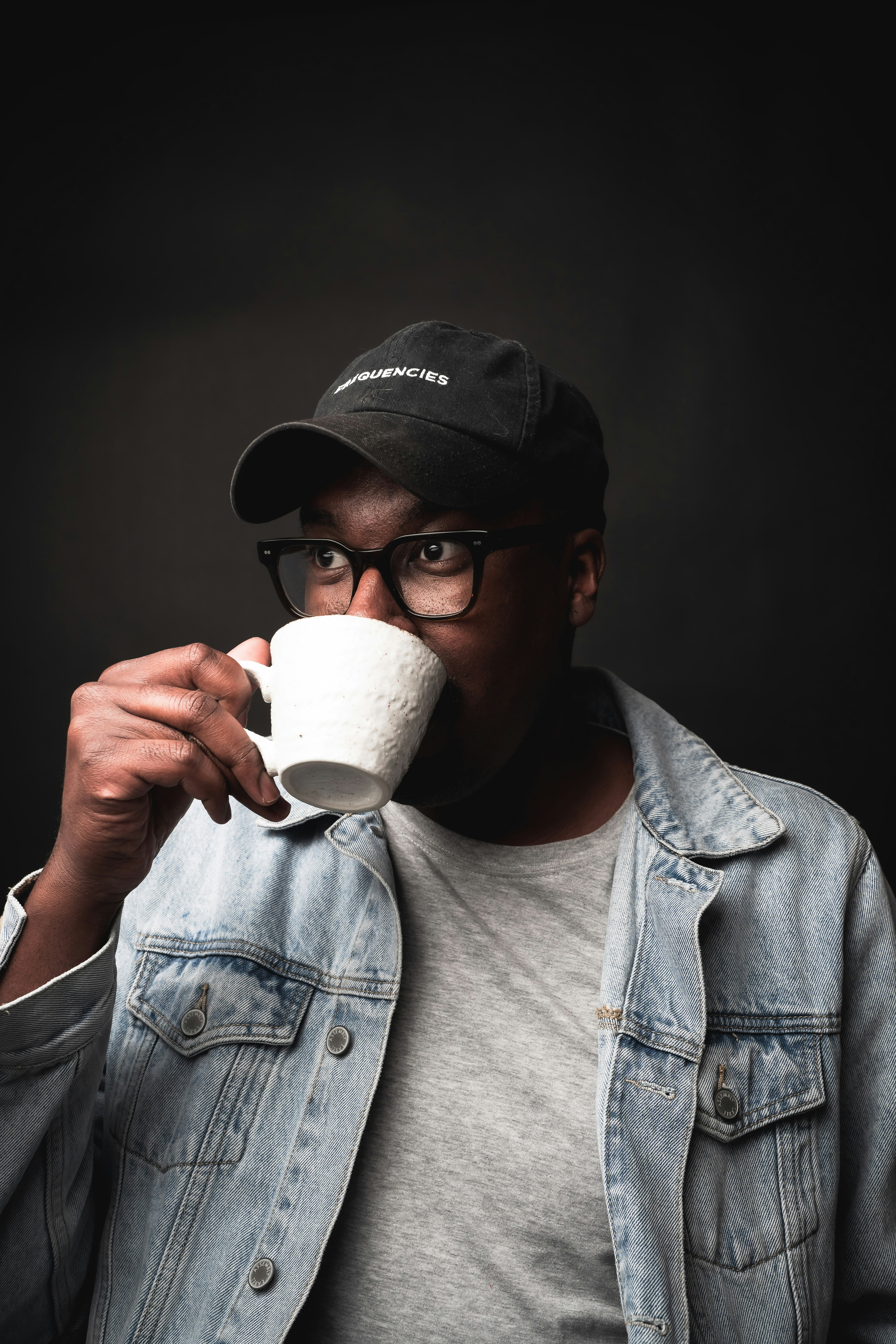 a man drinking from a cup