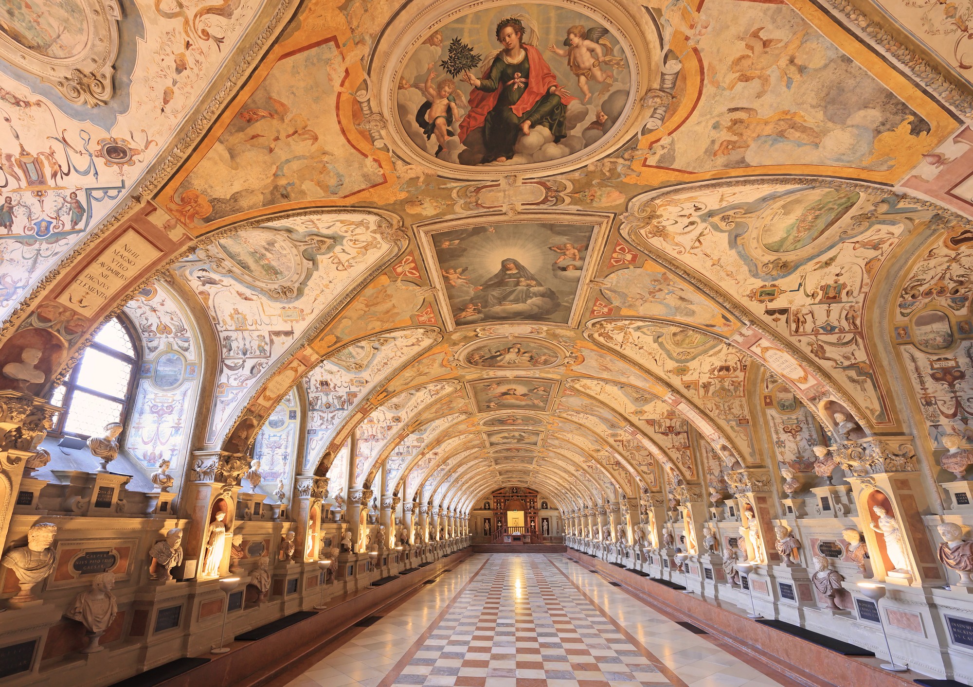 black car parked near white concrete building during daytime
