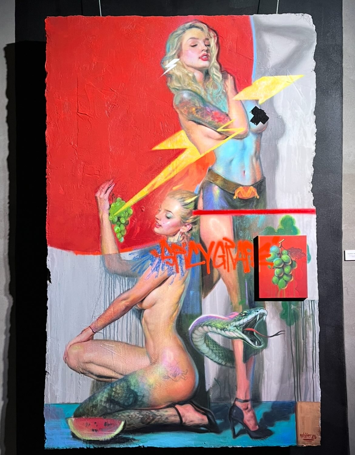 Young woman in colorful robe reads a book.