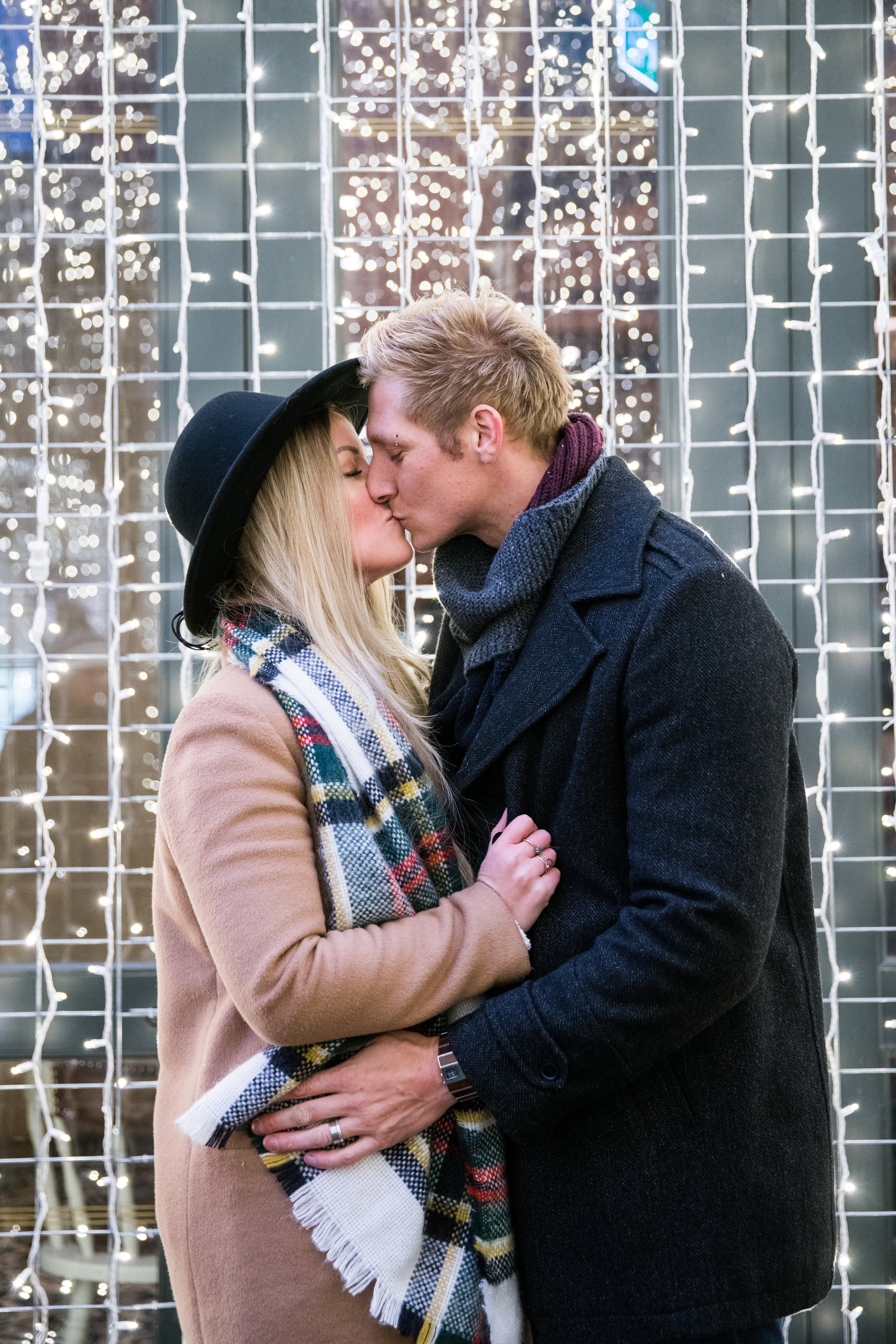 kissing couple with lights