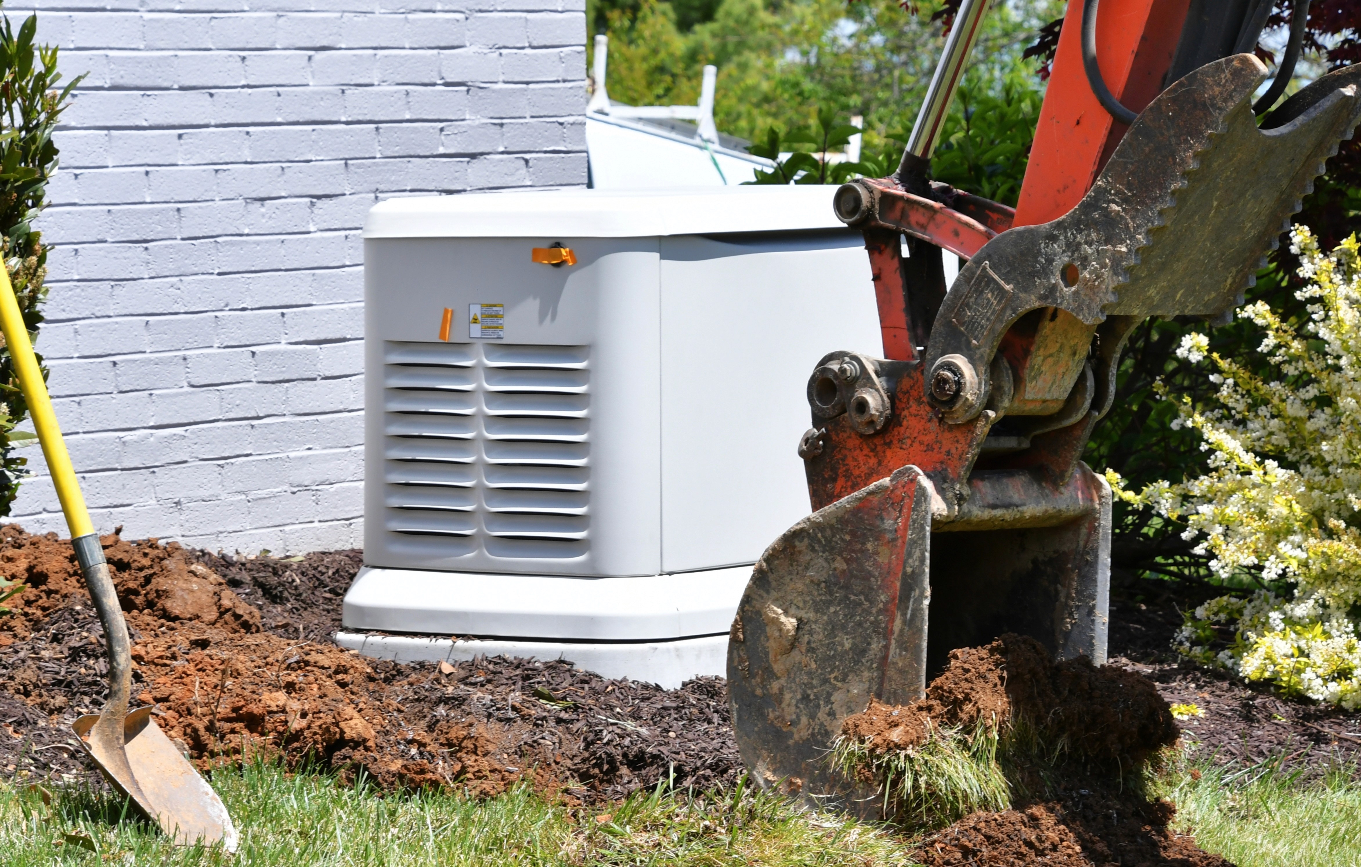 A white electrical box and a excavator
