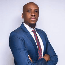 A young professional woman smiling against a white background.
