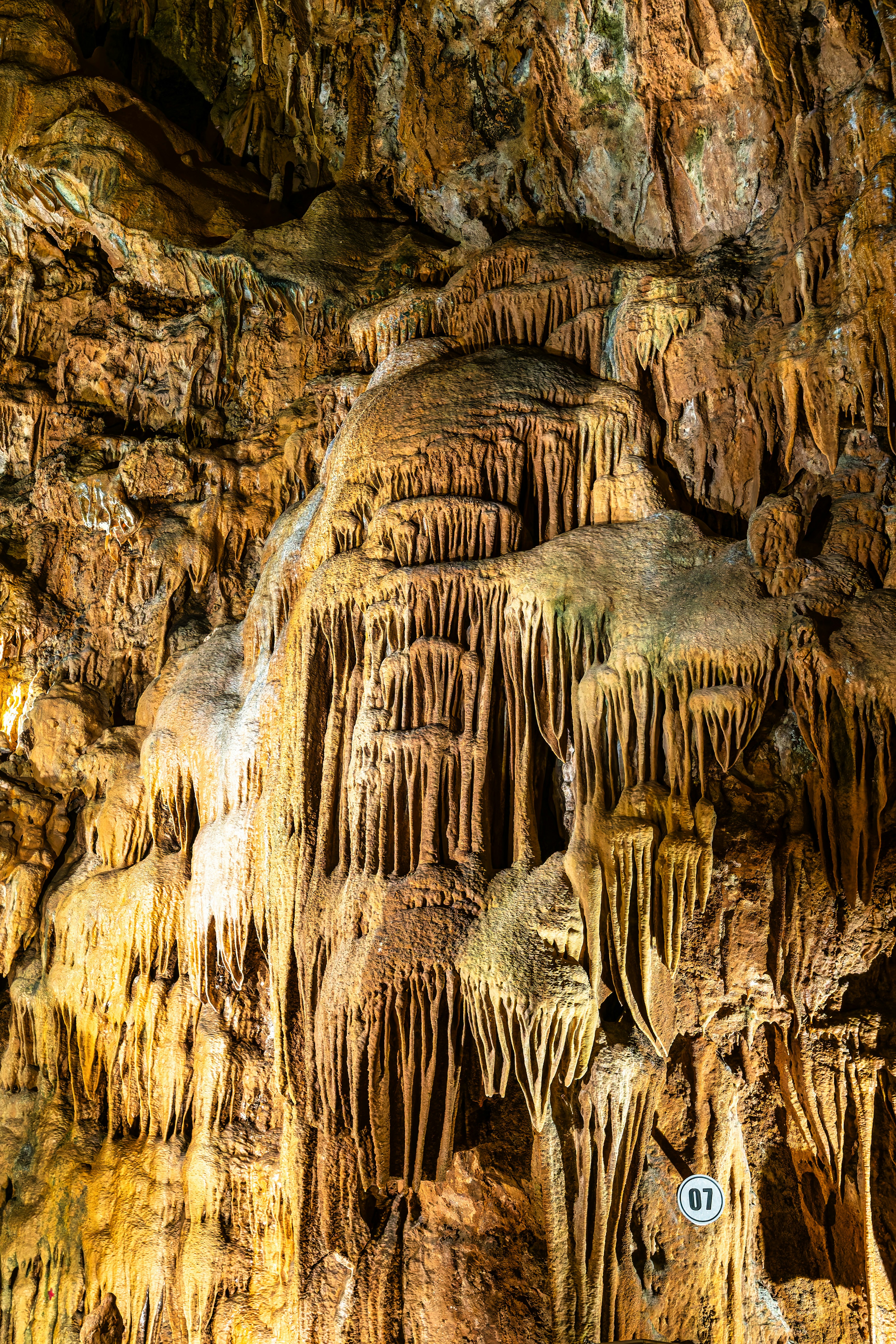 A close-up shot of a handcrafted welcome cocktail served at a Mediterranean hotel patio