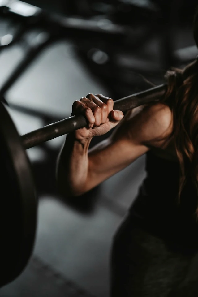 Close-up of a person gripping a workout bar during exercise