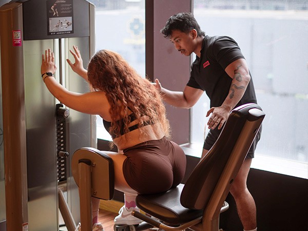 Personal Training In Kuala Lumpur, Woman doing a strength training with a personal coach