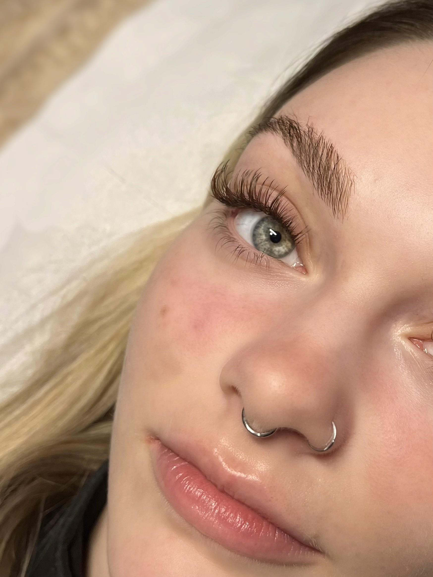 Close up of woman with dark natural eyelash extensions