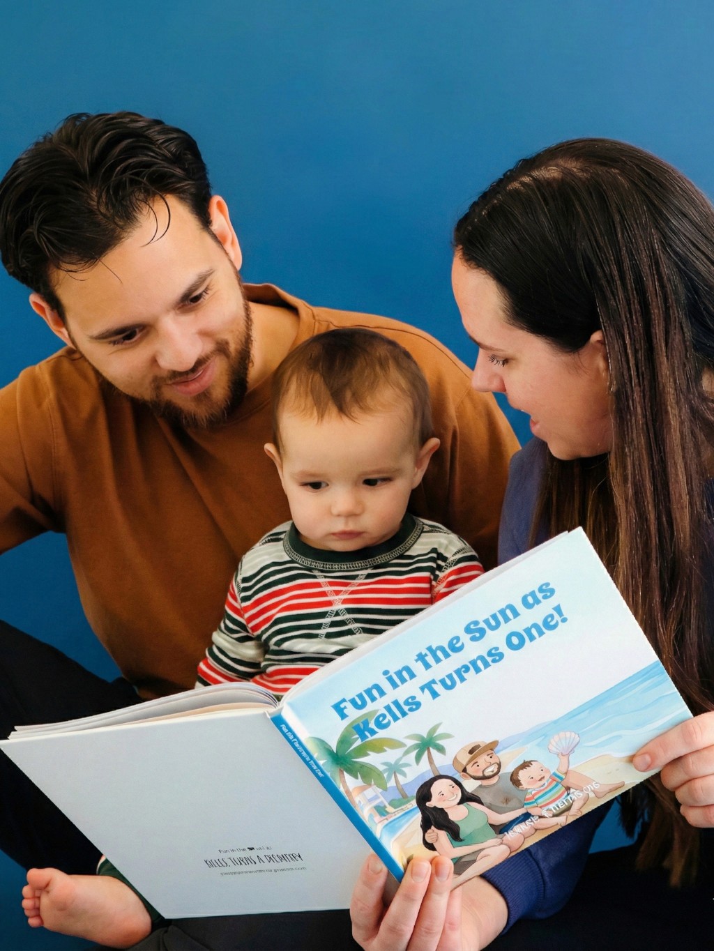 Close-up of a dark green leaf showing its textured surface and central vein against a muted background.