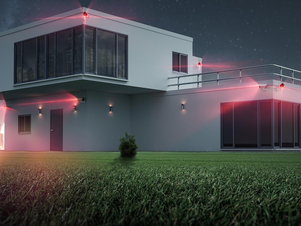 A couple relaxing on a couch in their living room, with a man holding a smartphone. A wall-mounted air conditioner is visible above them.