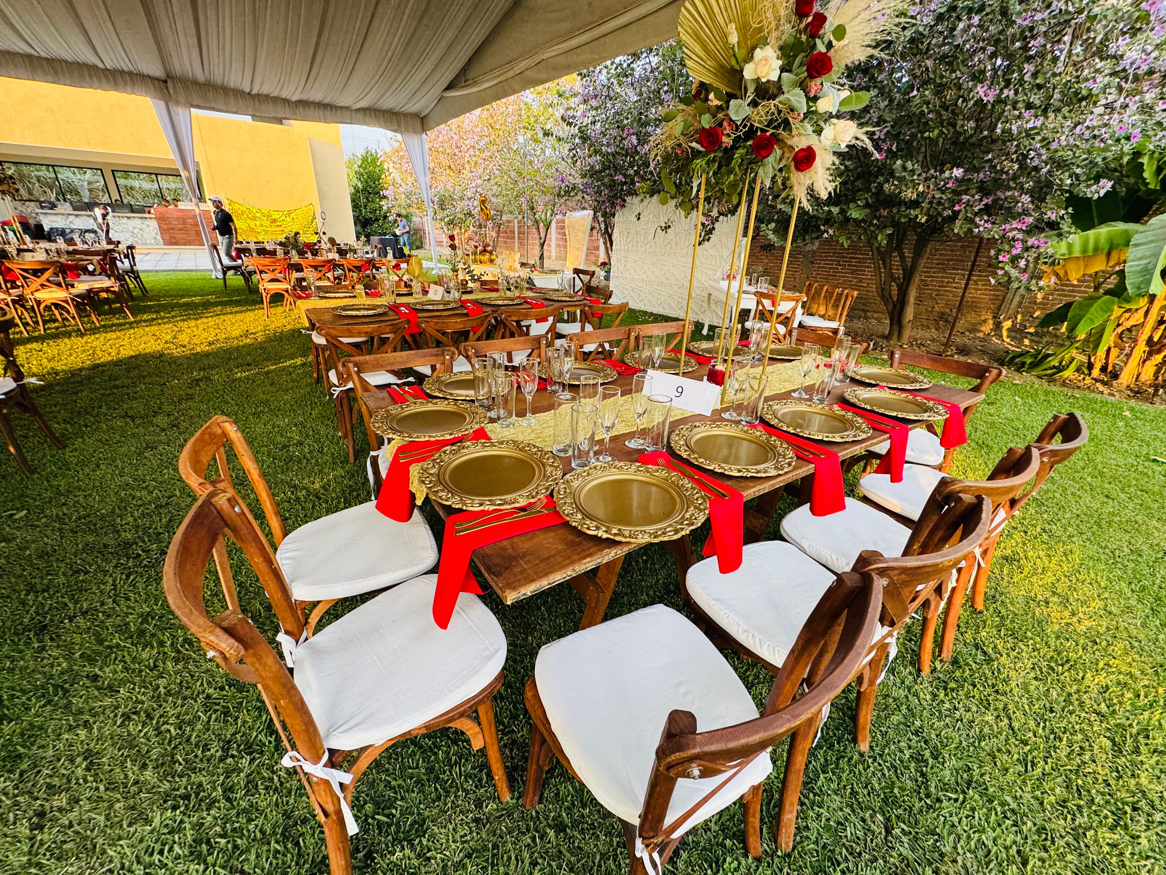 A sophisticated lounge terrace with curved white stucco walls, stone seating, and arched cutouts perfectly framing an unobstructed ocean sunset.