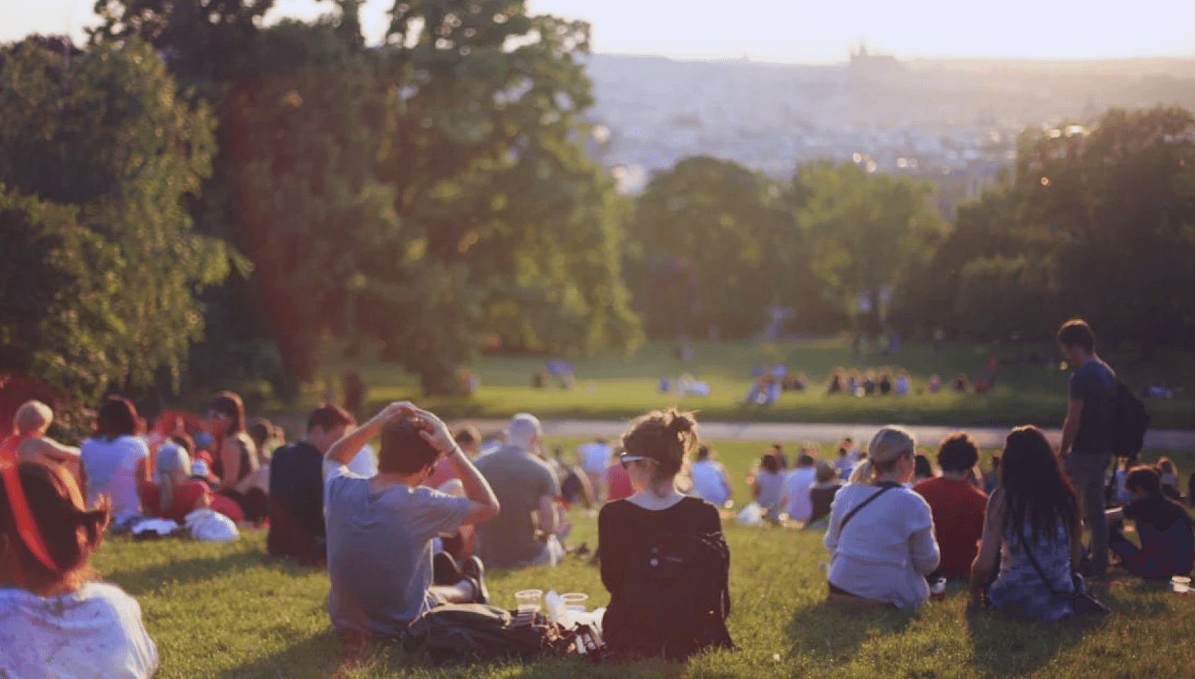 A community of people gathered in a garden.