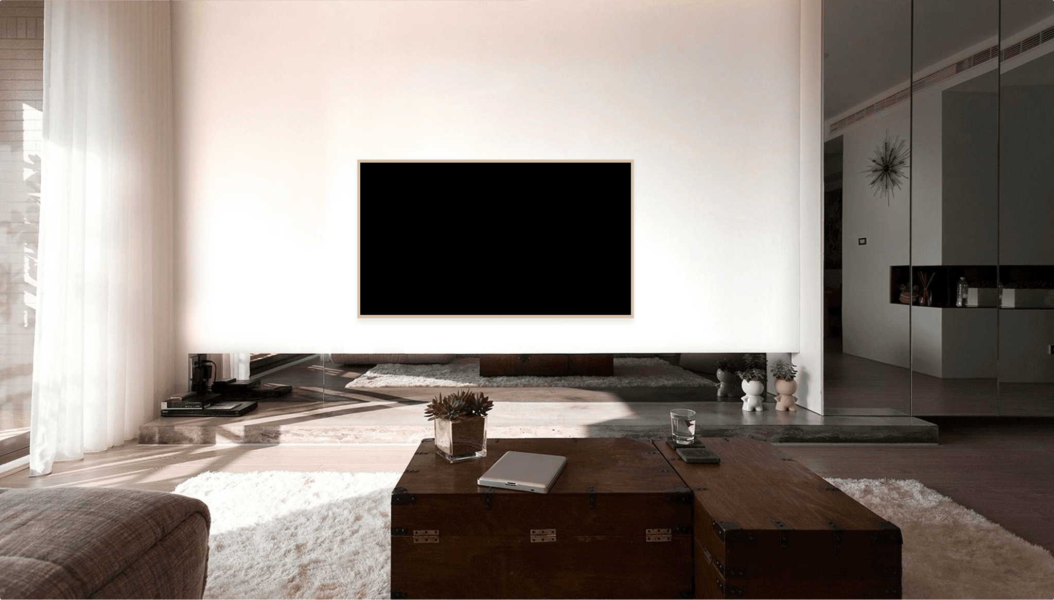 Image of people at a desk with their computers