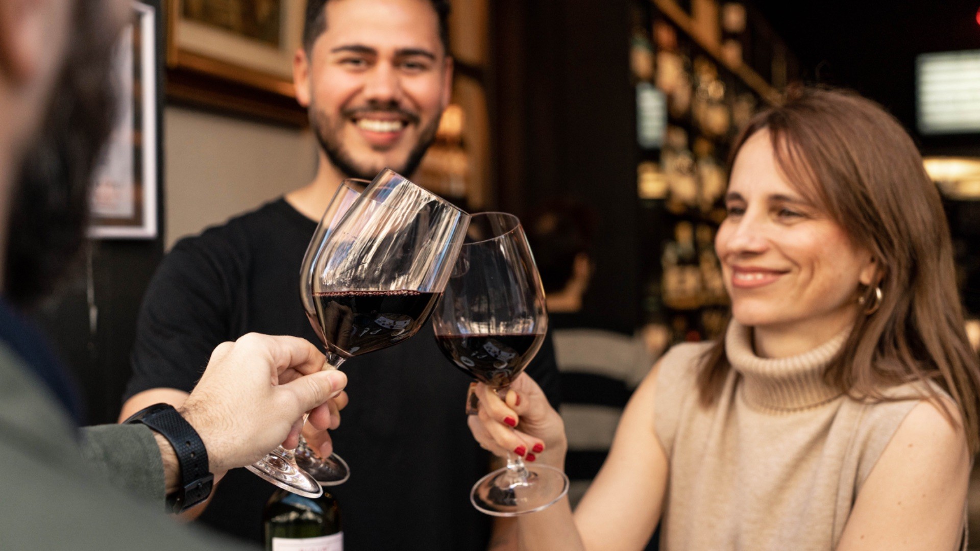 Sommelier leading guests in a wine tasting during a small-group Barcelona food and wine tour.