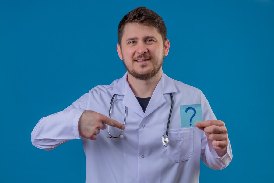 A doctor showing a question mark card.