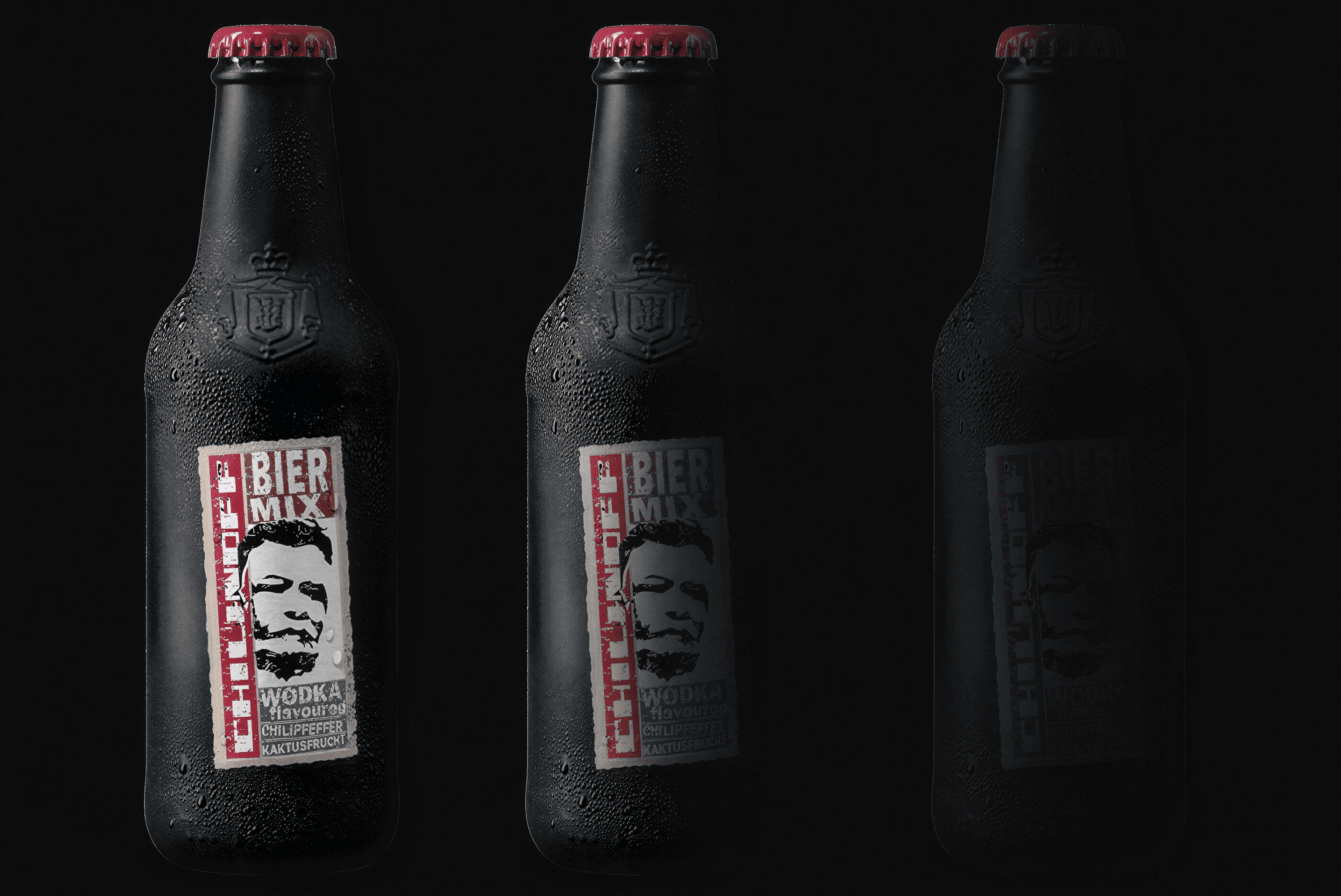 Three bottles of Bier Mix vodka with chilipepper and cactus fruit flavor.