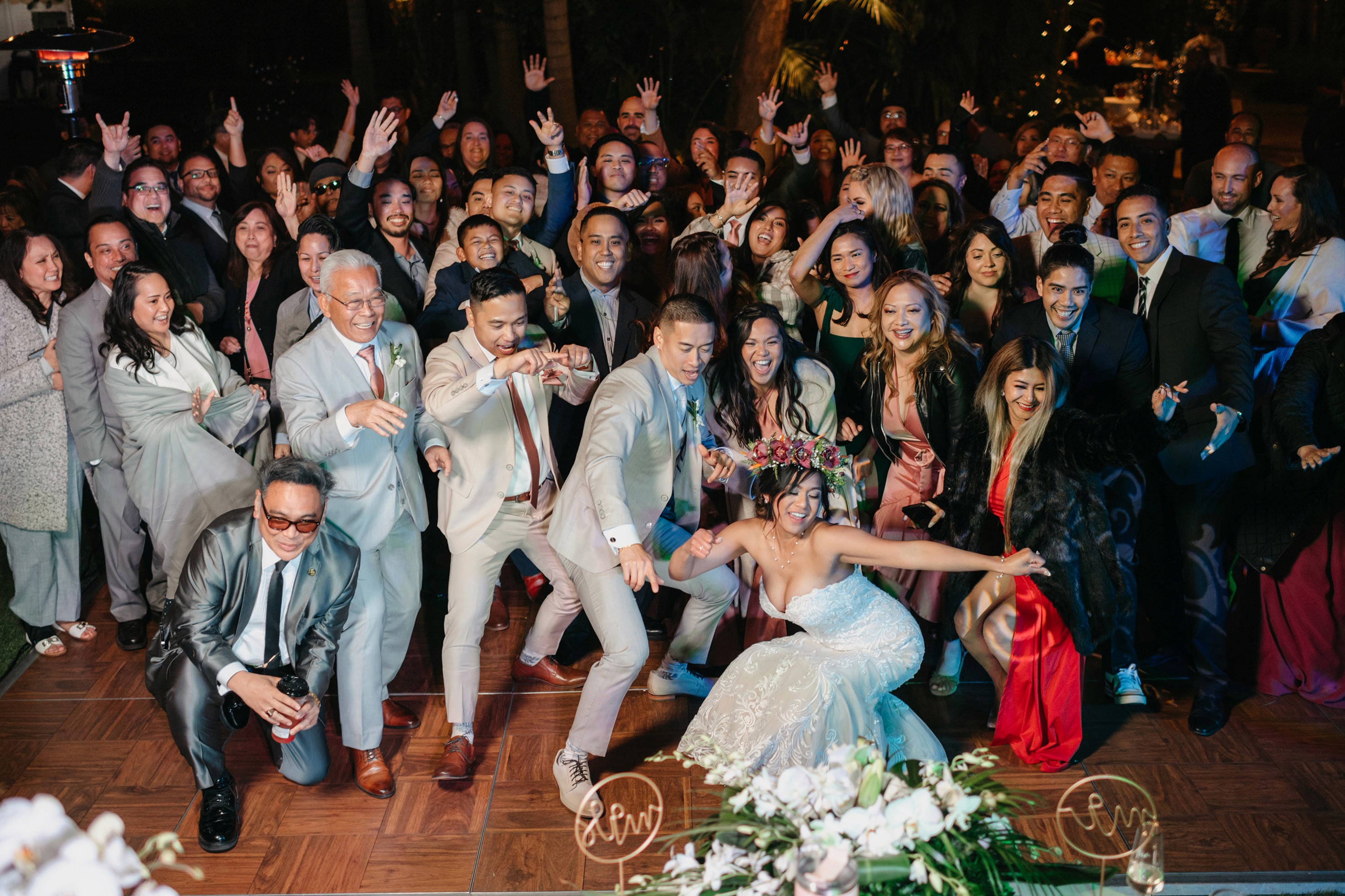 High-energy dance floor photos at outdoor wedding reception