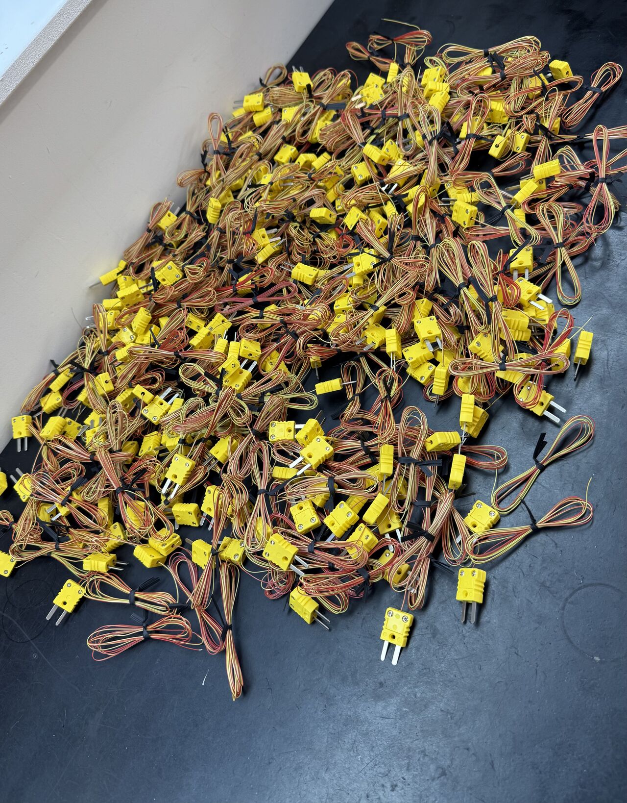 A small airplane flying through a blue sky