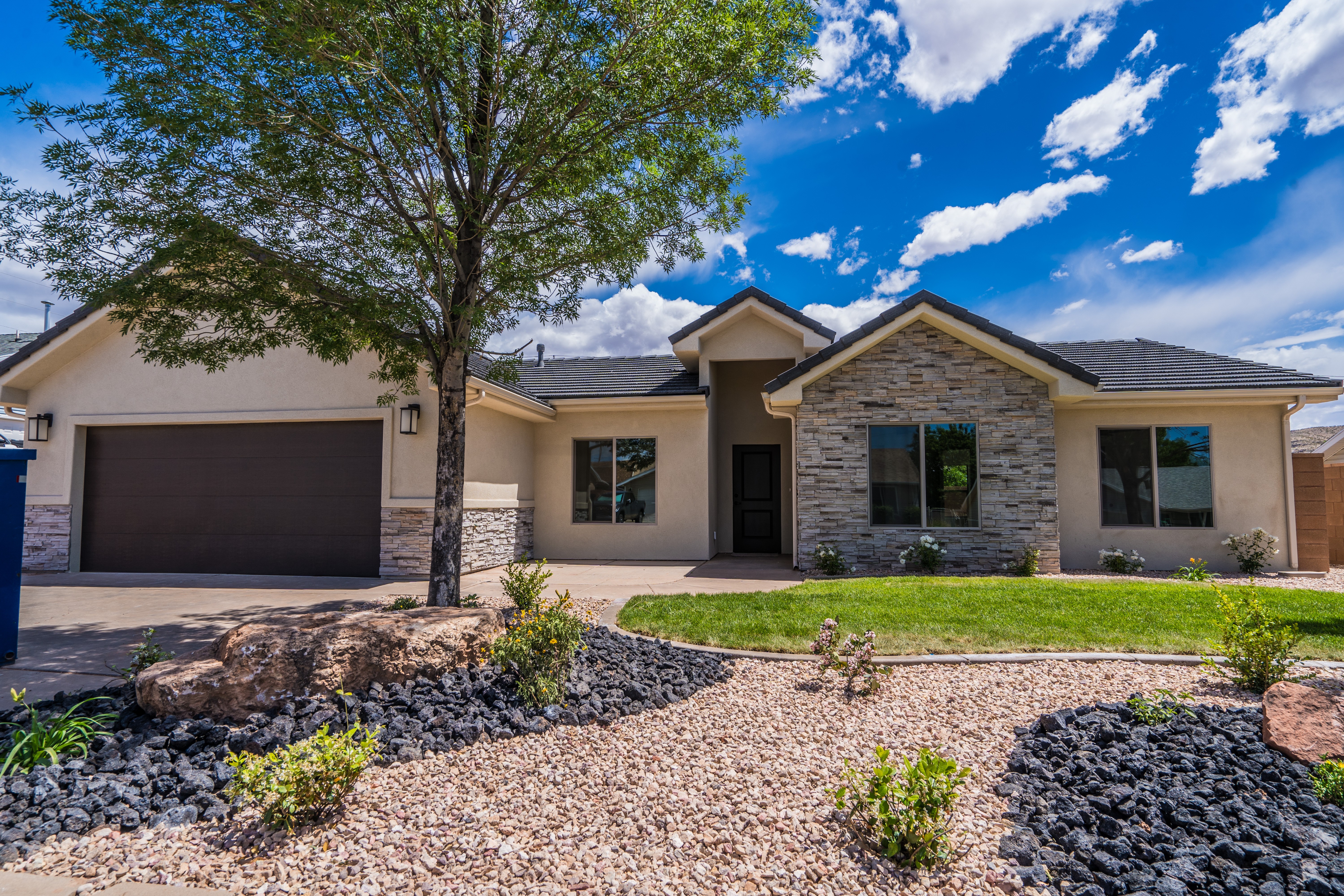 Front elevation of a Southern Utah remodeled home with clean, light exterior palette.