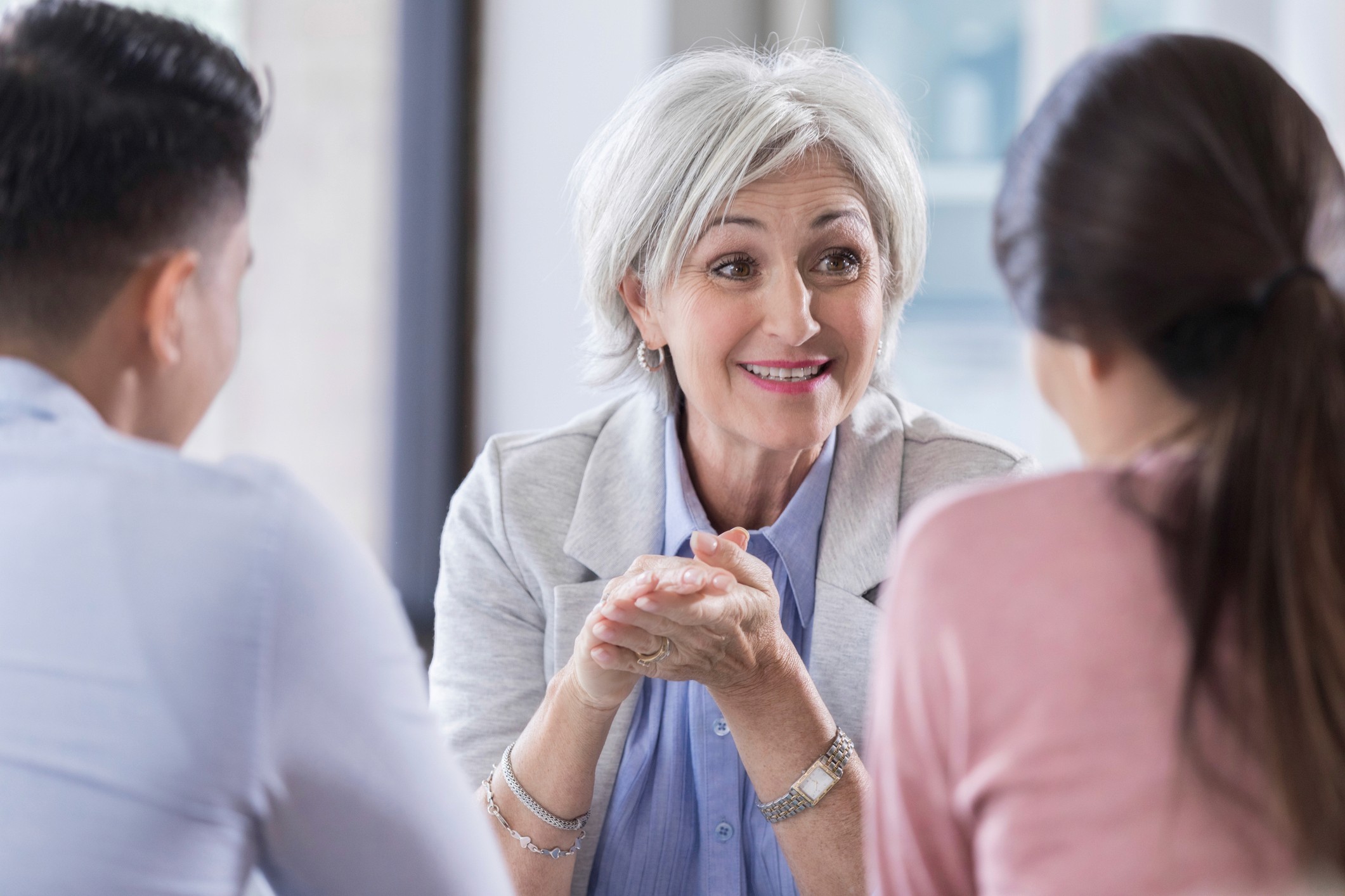A meeting between three people