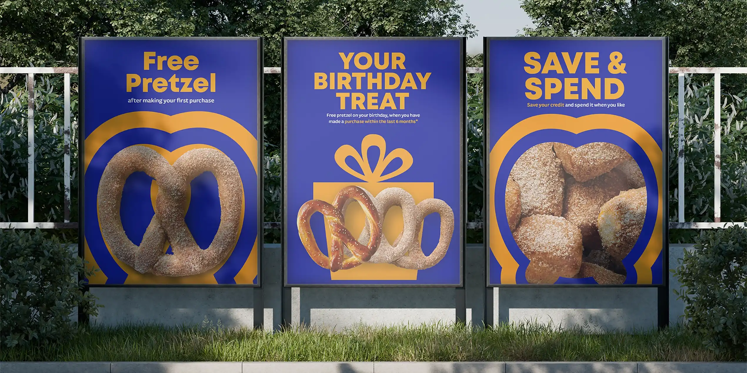 Auntie Anne's three billboards advertising pretzels, birthday treat and save & spend