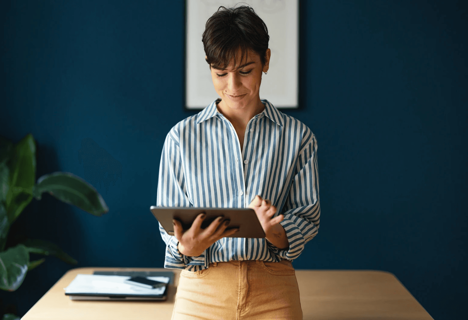 Professional managing tasks on a tablet with TickedOff solutions