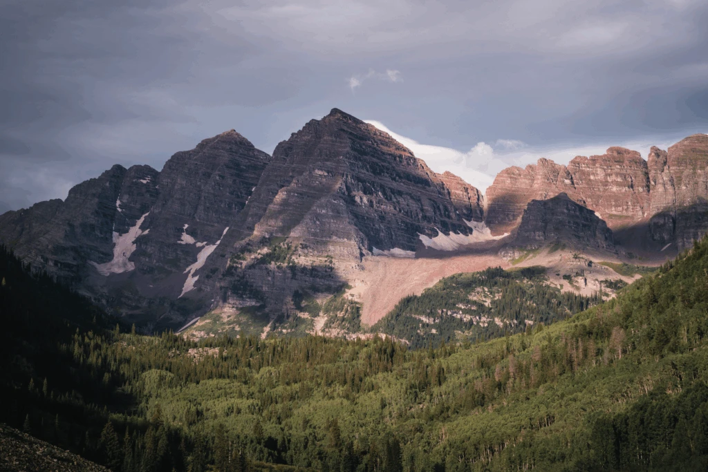 Jagged mountain peaks above a forested valley