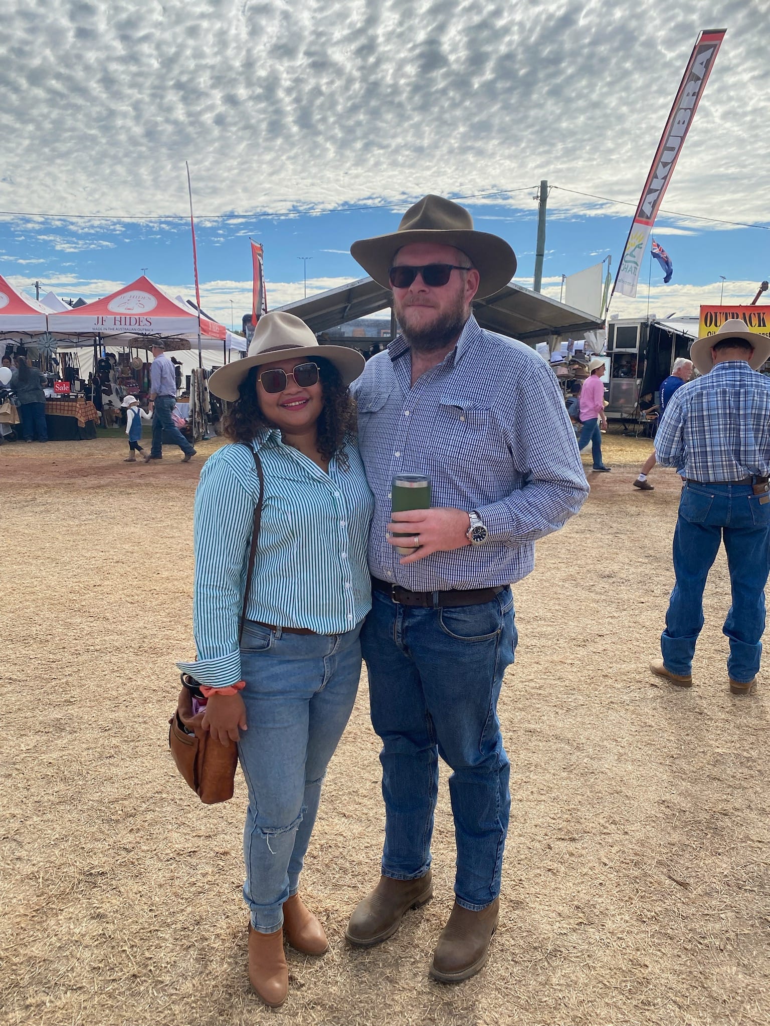 Monica & Joe the owner of Emerald Clean Cut smiling with a cowboy hat in Emerald, Queensland