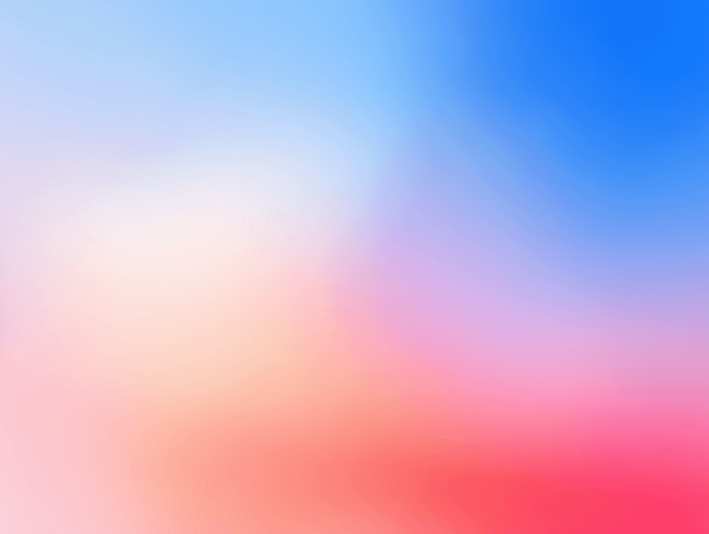Soft gradient of blue, pink, orange, and red hues.