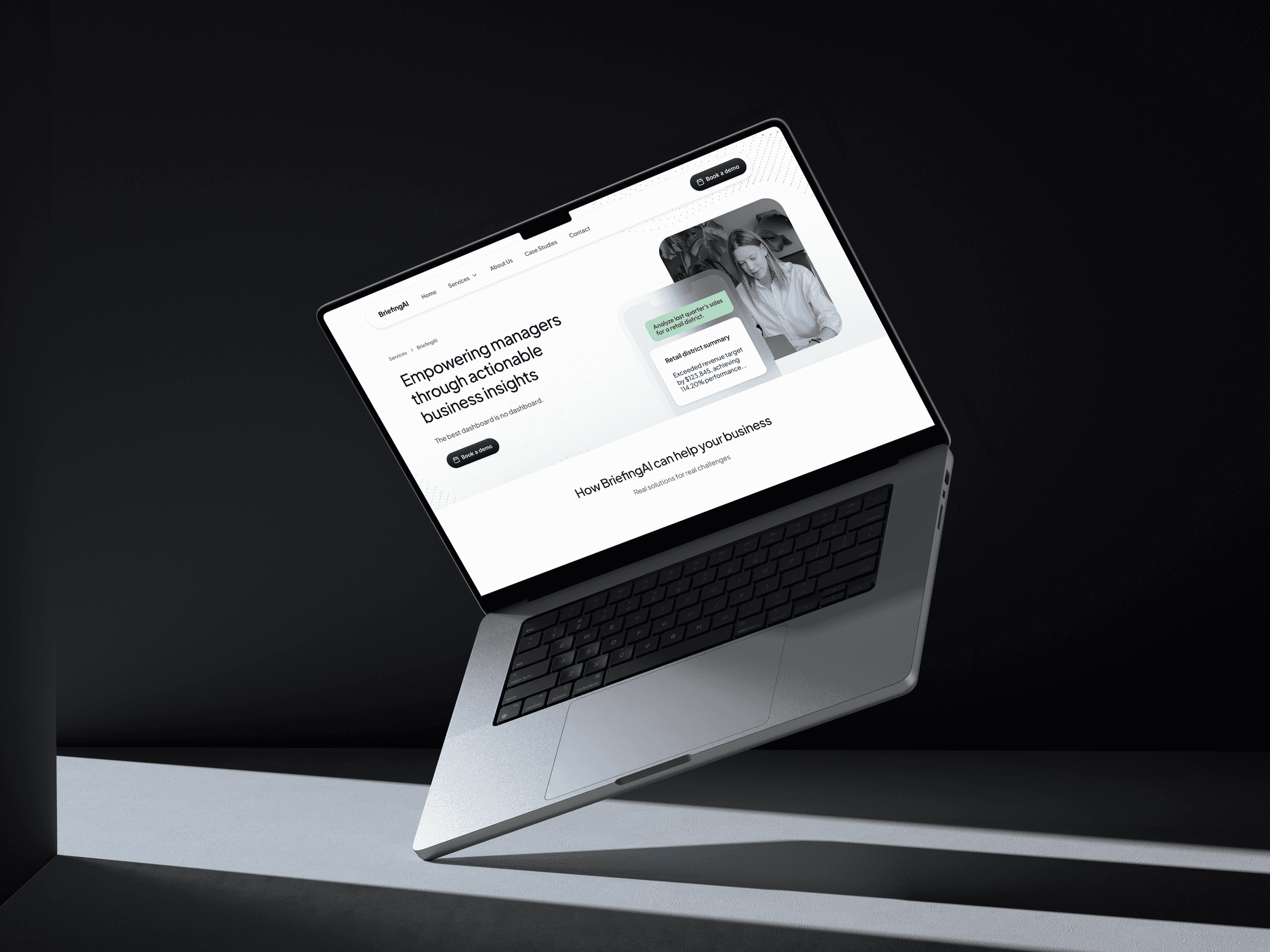 Laptop displaying a website with business insights dashboard.