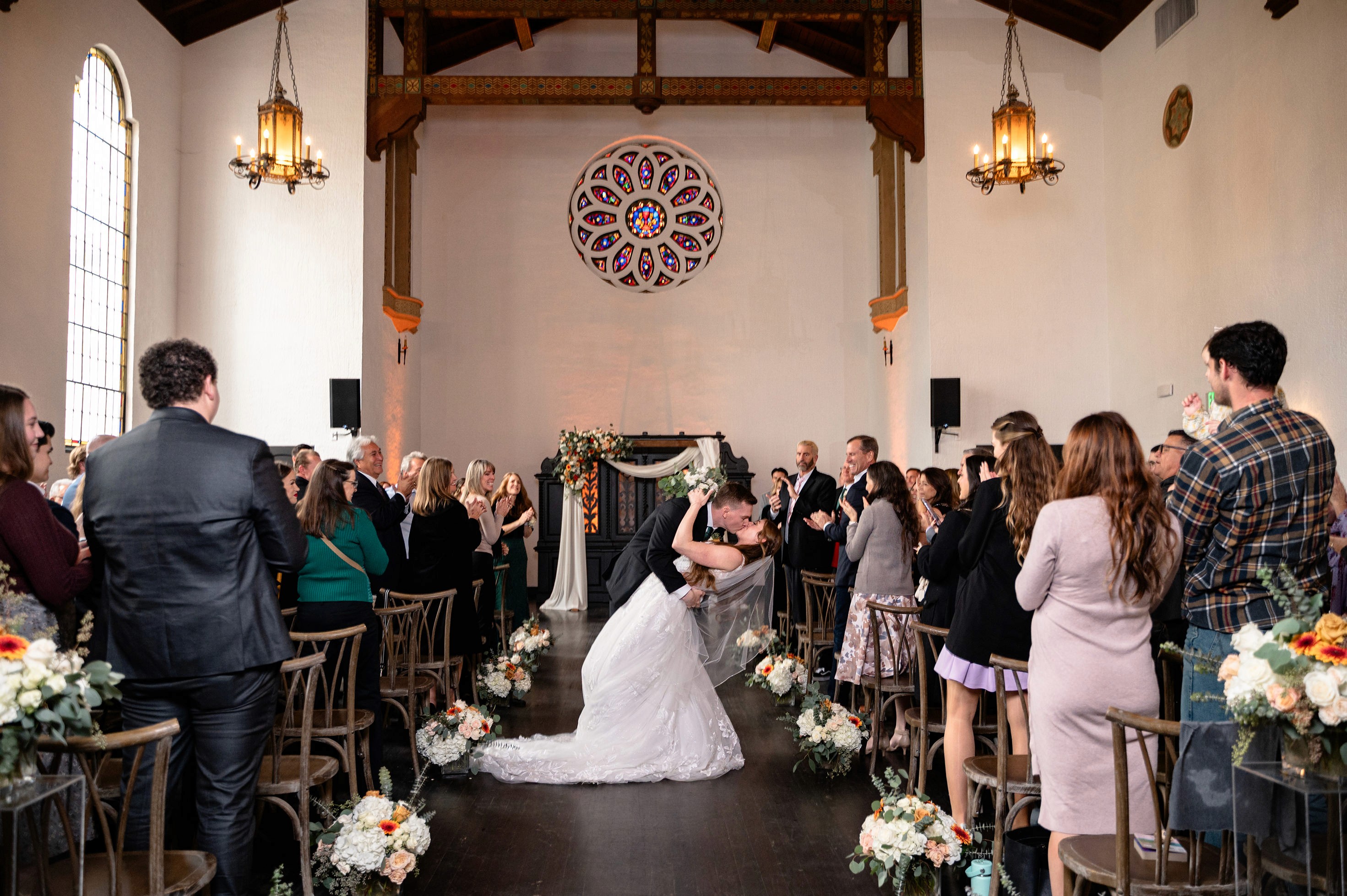 Flat lay wedding details with bouquet, rings, and sparkling bridal heels