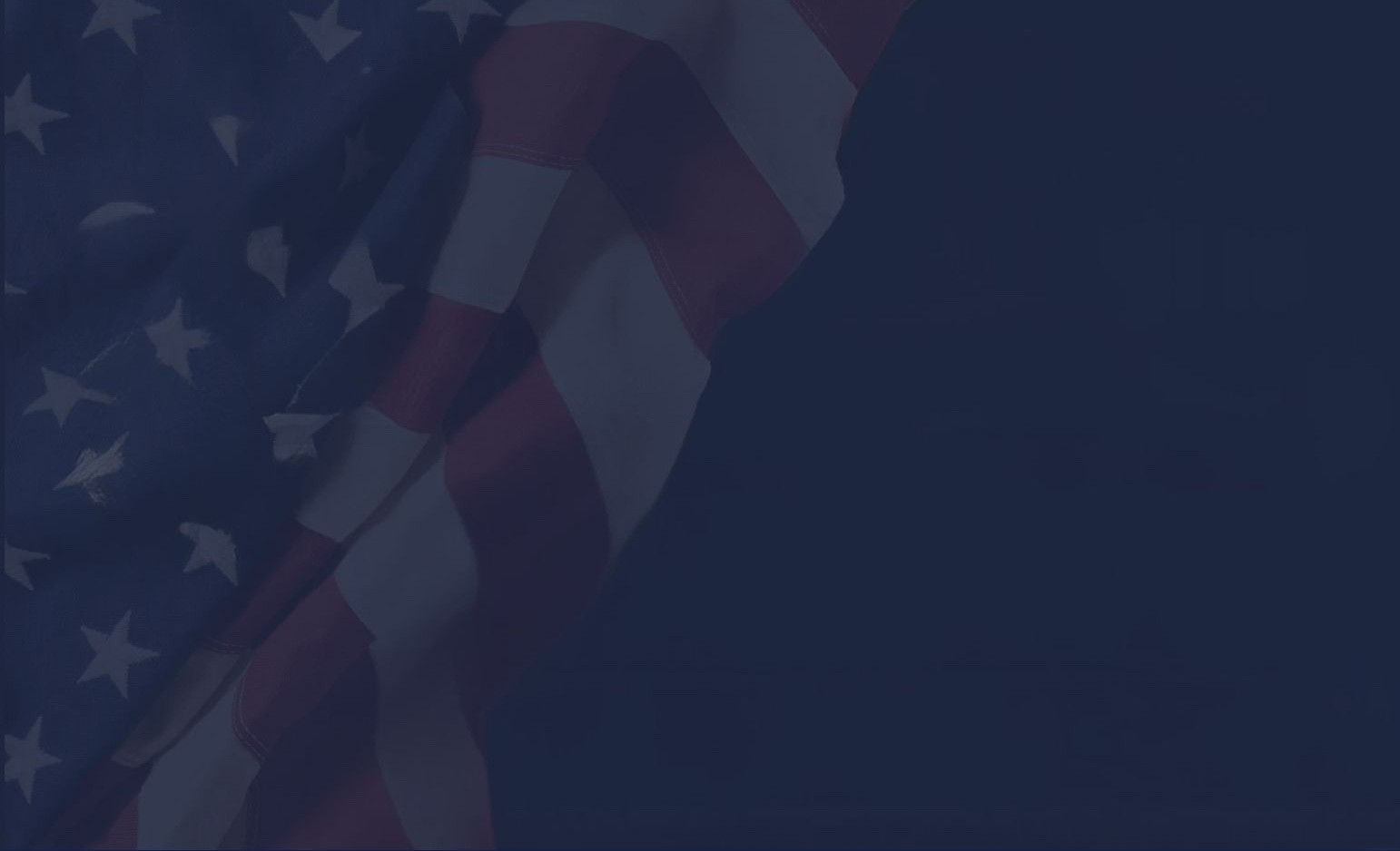 A partial view of an American flag on a dark background, showcasing red and white stripes with blue field.