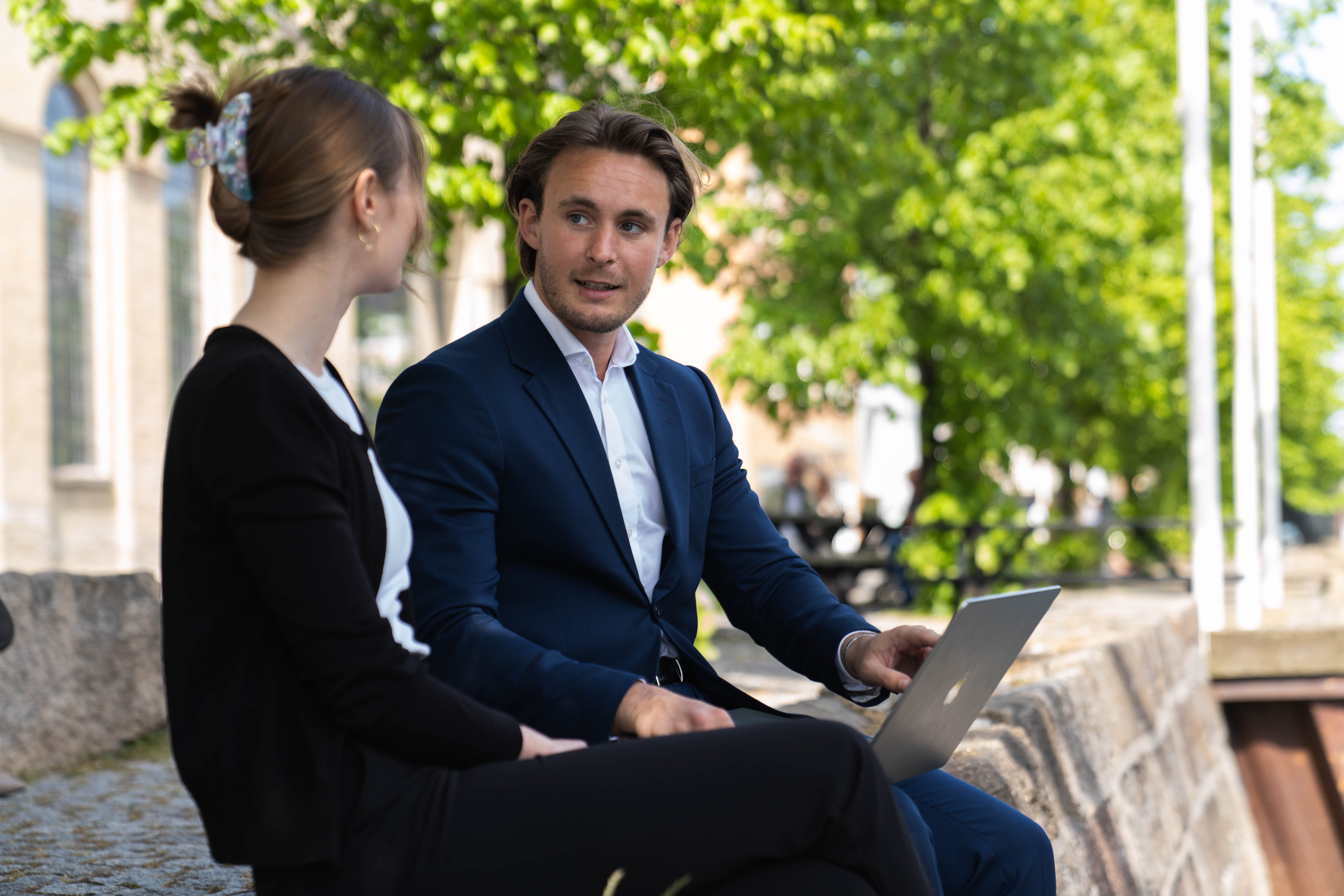 Glowing red biological cells seen under a microscope, suggesting cellular or molecular research imagery.