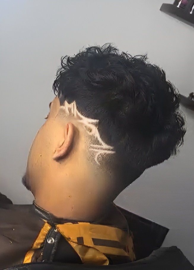 Man with beard getting hair blow-dried