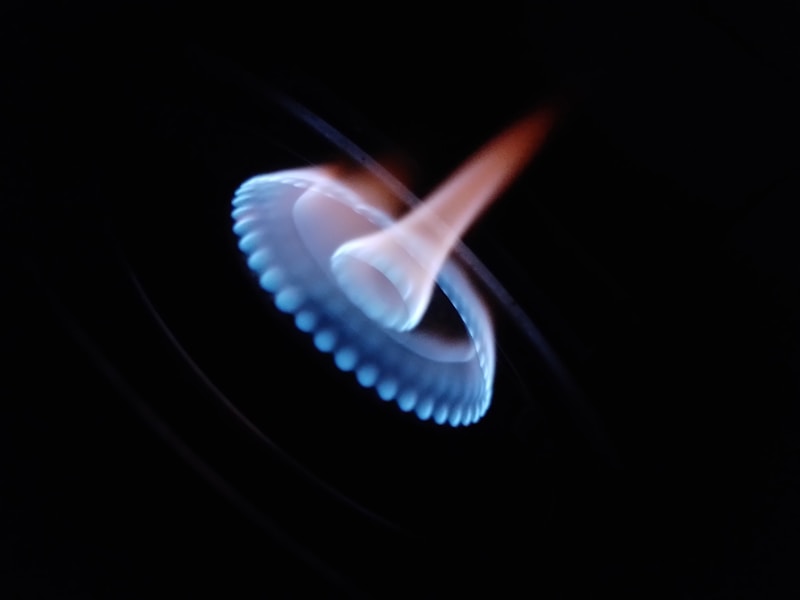 Close-up of a blue gas flame burner