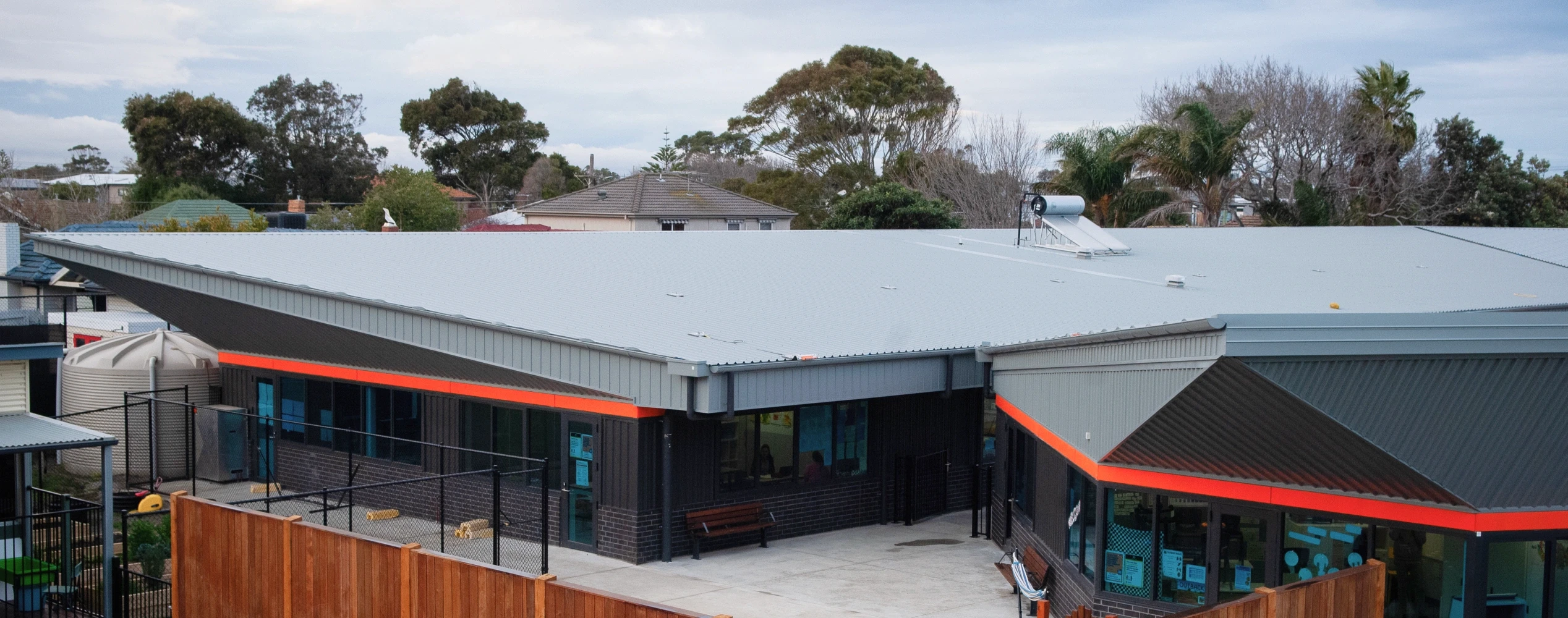 A view of a building with a red roof