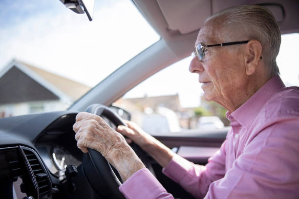 Older gentleman driving a vehicle