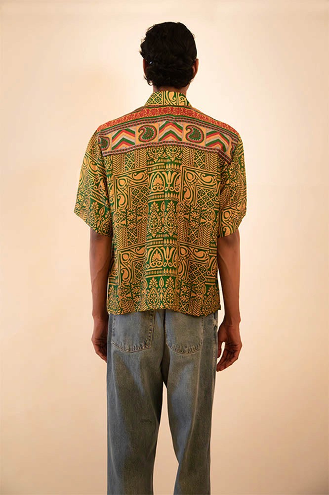 Printed green  silk shirt featuring piping detail, handcrafted from vintage fabric with a relaxed fit and a focus on conscious, artisanal design