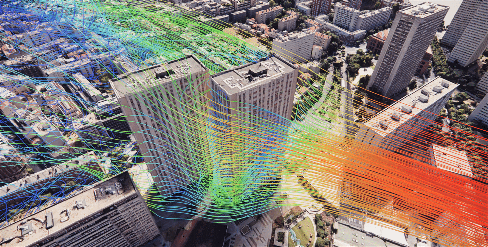 3D airflow simulation streamlines overlaid on an aerial view of buildings
