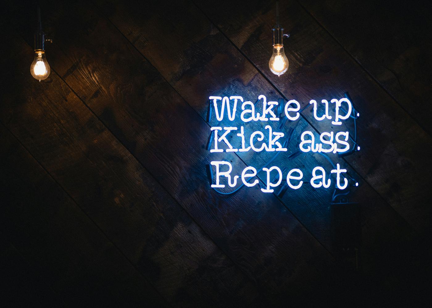 Motivational neon sigh against a dark background