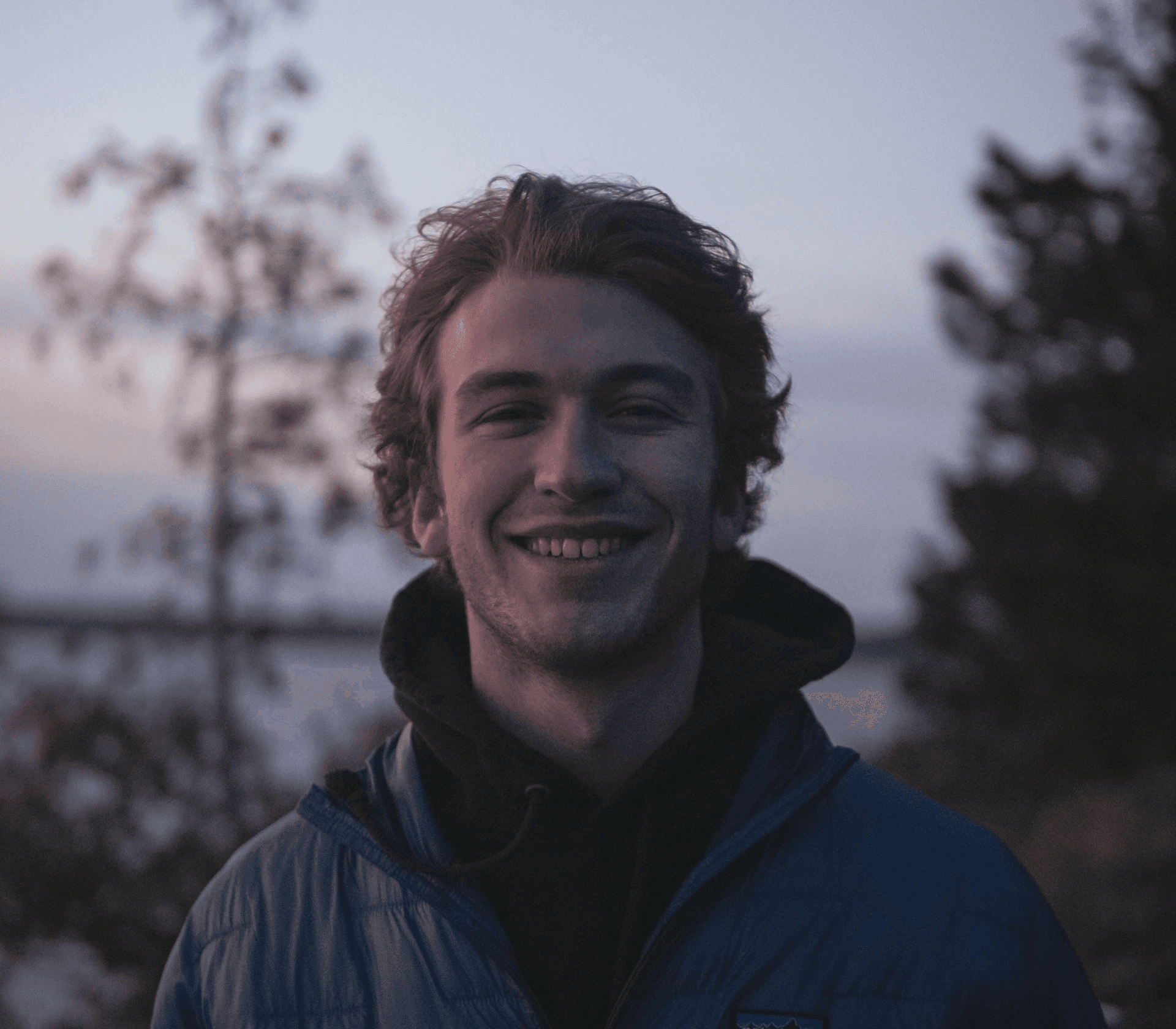 A portrait of a young man smiling