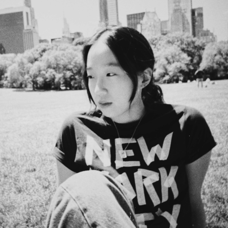A portrait of Sangjin Park, also known as Jinny Park, who is from New York, NY and is a member of the class of 2027. The image may feature Jinny smiling or engaging in an activity, with an Instagram handle visible, indicating a connection to social media.