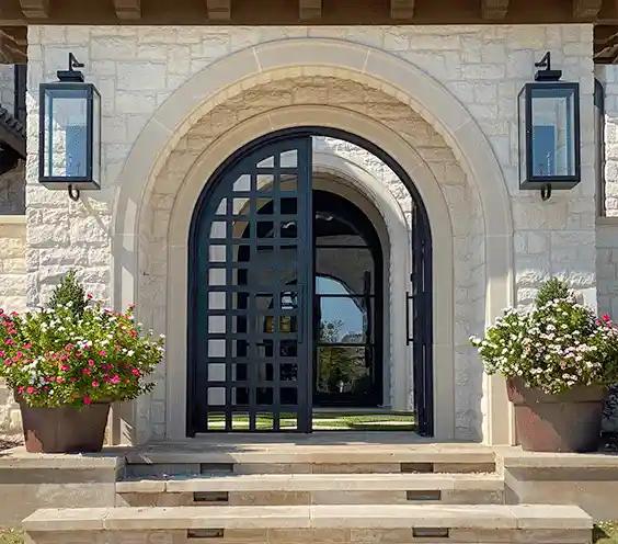 front view of a DFW Texas home with low profile iron doors by M2 Iron Doors