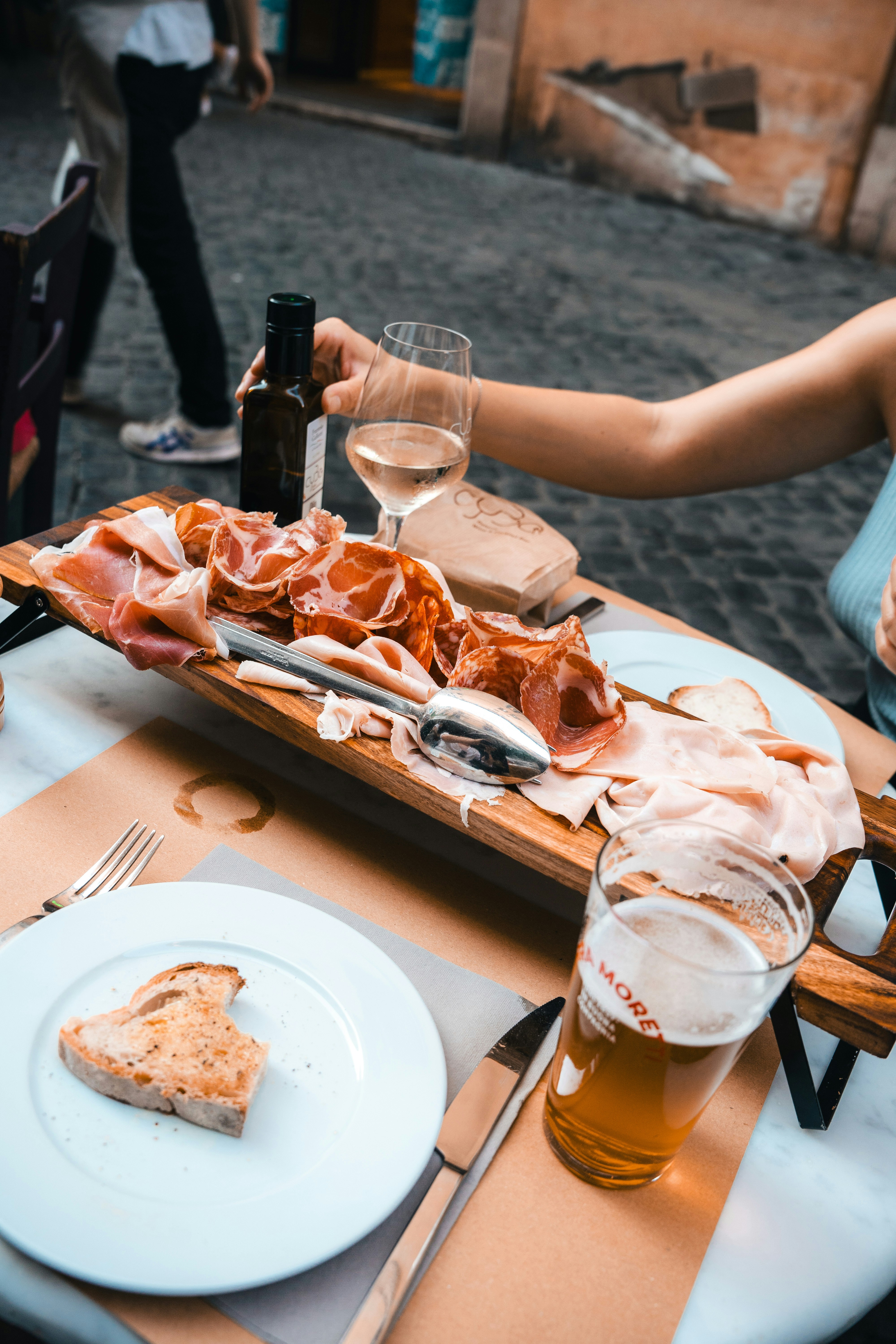 A person sitting at a table with a plate of food