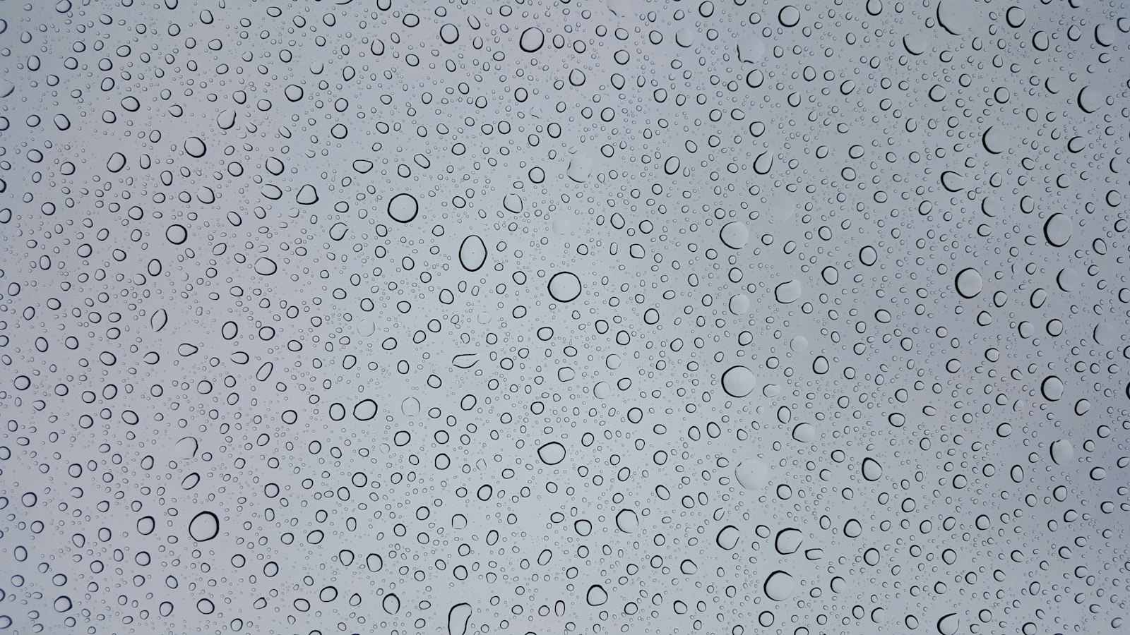 Fine condensation covering a cool grey surface