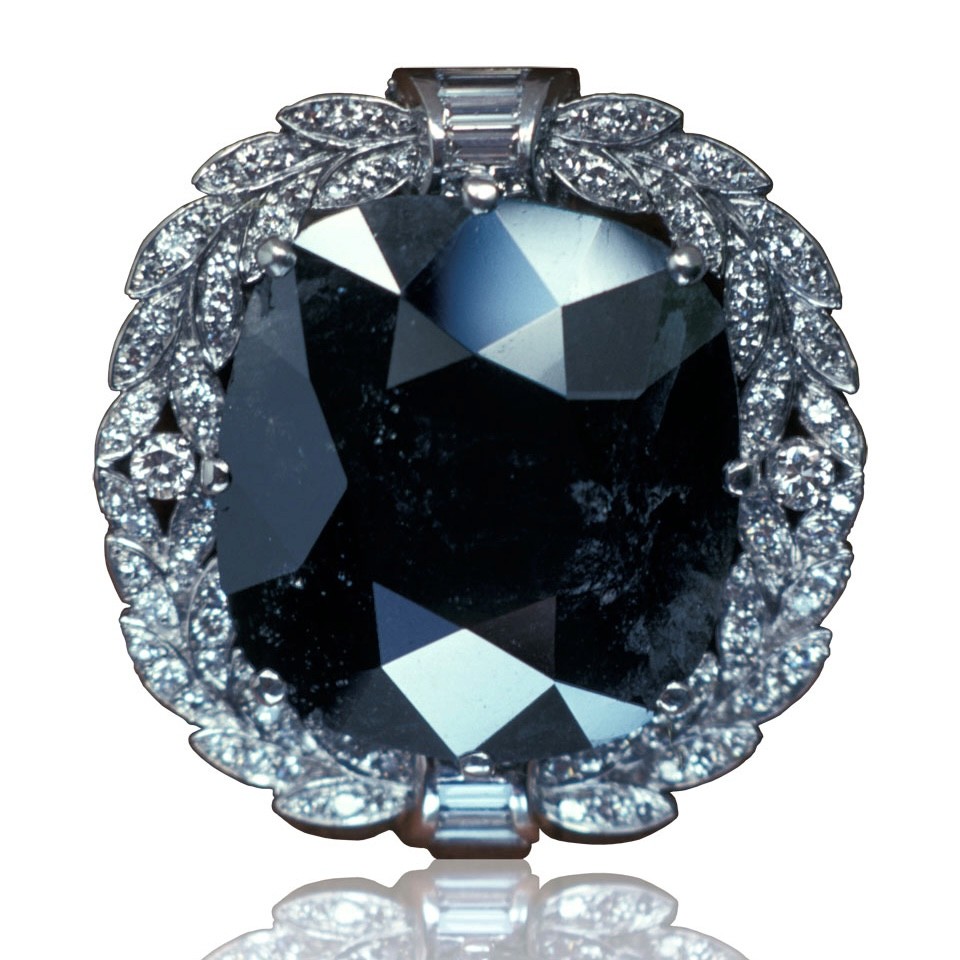 Dark blue historic diamond set in a vintage frame, symbolising legendary diamonds with mysterious reputations