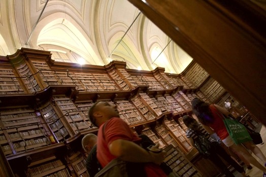 students walking through the library