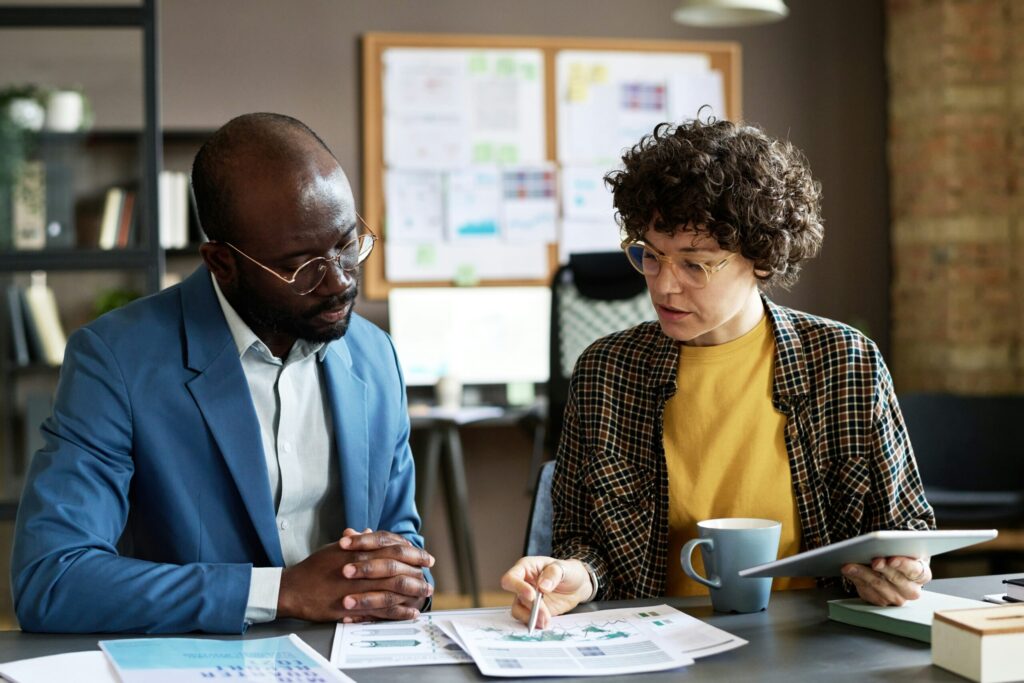 Two People Looking Over Finances